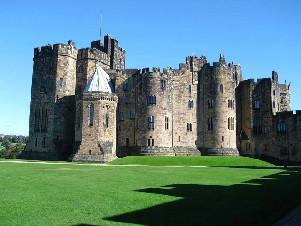 Alnwick Castle in Northumberland England, historic medieval fortress and popular stop on Harry Potter tours from Scotland