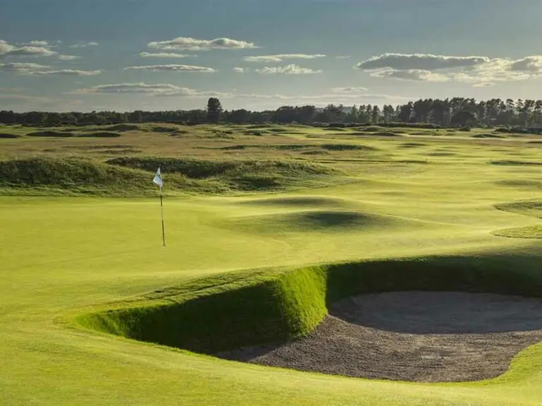 Carnoustie Golf Links green and bunker on a sunny day in Carnoustie, Scotland, famous golfing destination and tourist attraction