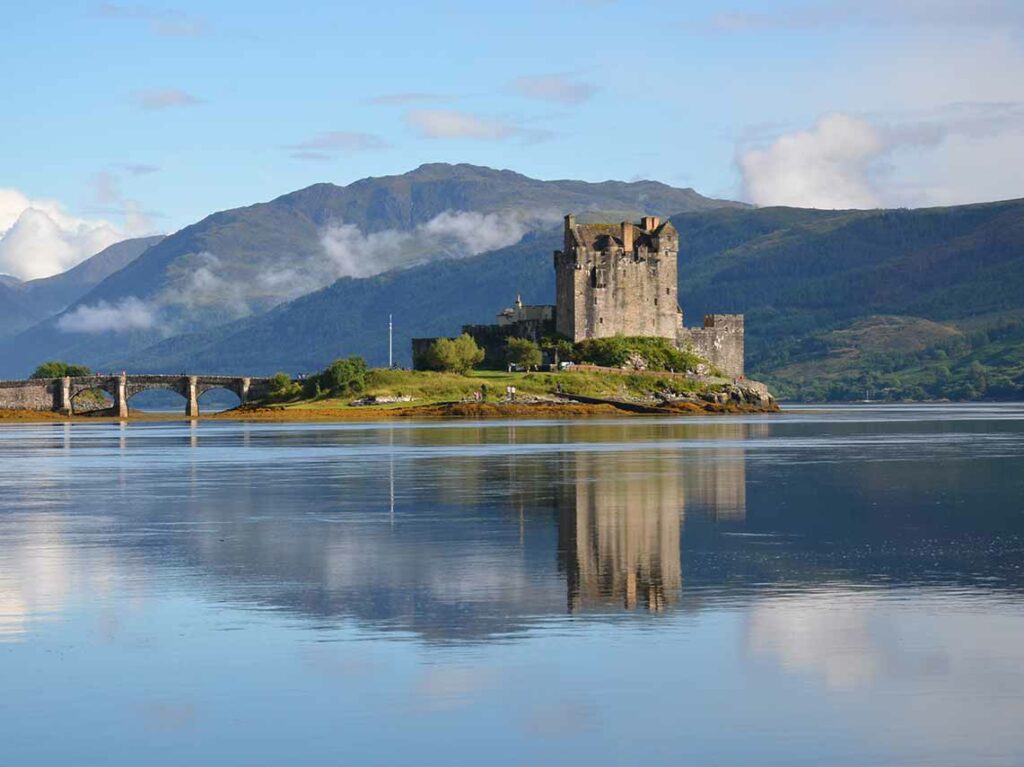 Eilean Donan Castle with mountain backdrop