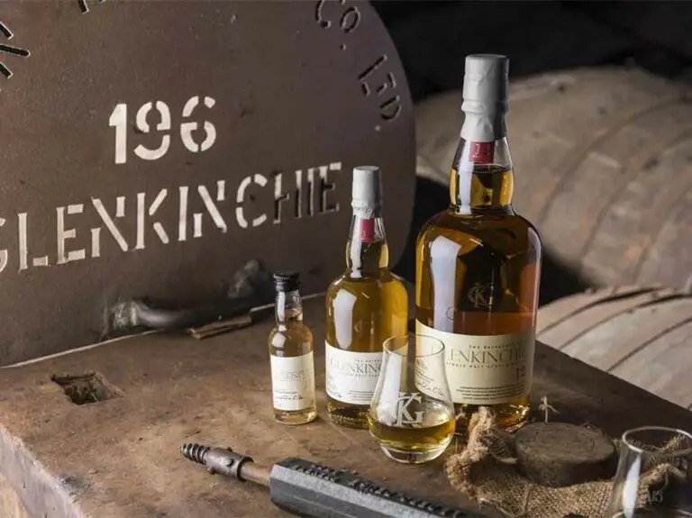 Glenkinchie Lowlands Whisky bottles and glasses displayed in a traditional Scottish distillery near Edinburgh, Scotland
