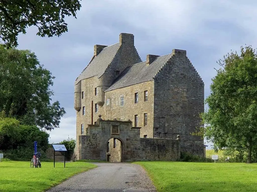 Historic Midhope Castle near Edinburgh, Scotland, surrounded by greenery, popular tourist attraction on Braw Scottish Tours