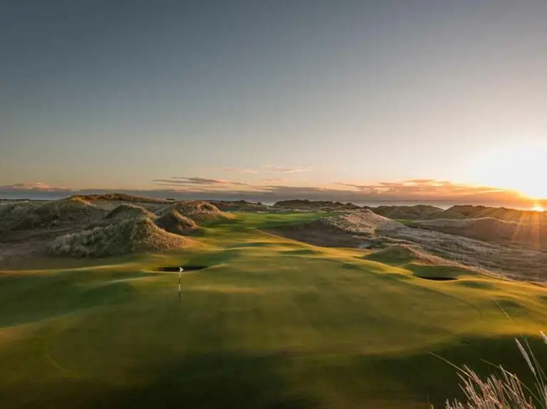 Royal Aberdeen Golf Course in Aberdeen Scotland at sunset featuring rolling dunes and scenic coastal landscape