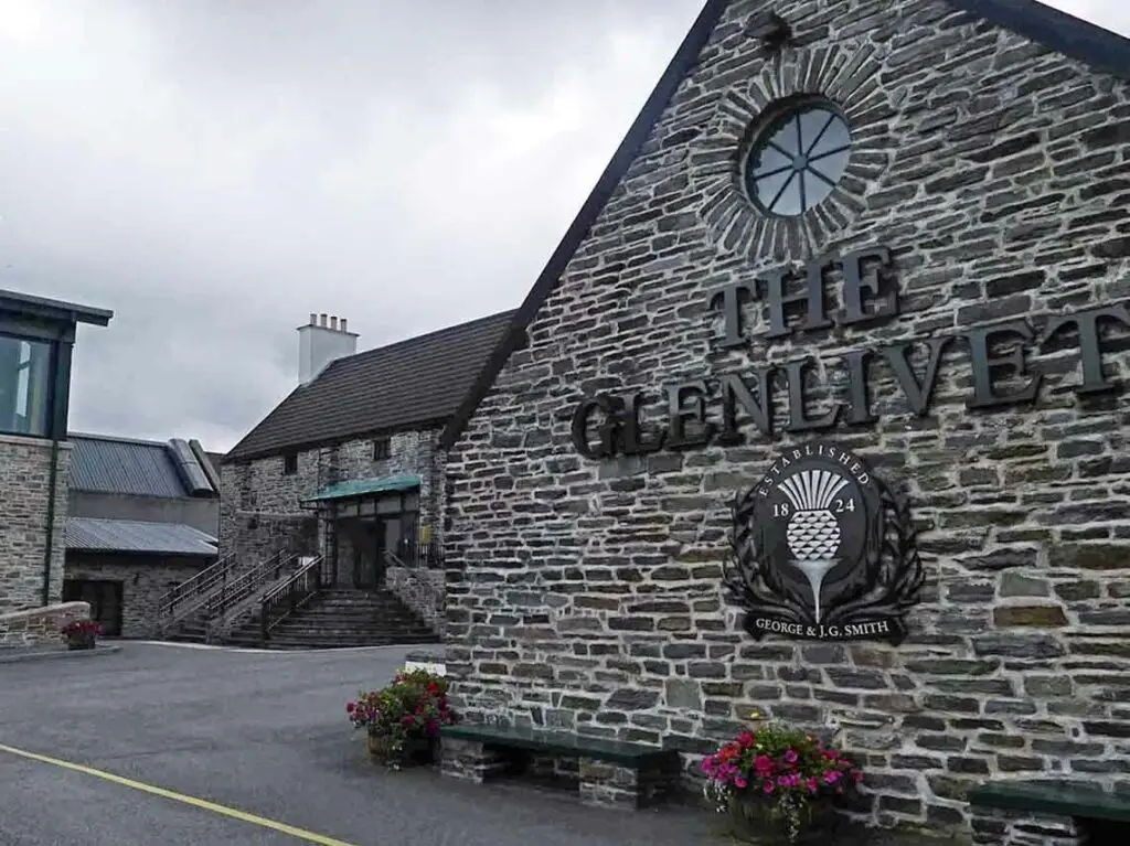 The Glenlivet Distillery in Ballindalloch, Scotland, historic whisky distillery with stone buildings and visitor entrance for Scottish whisky tours