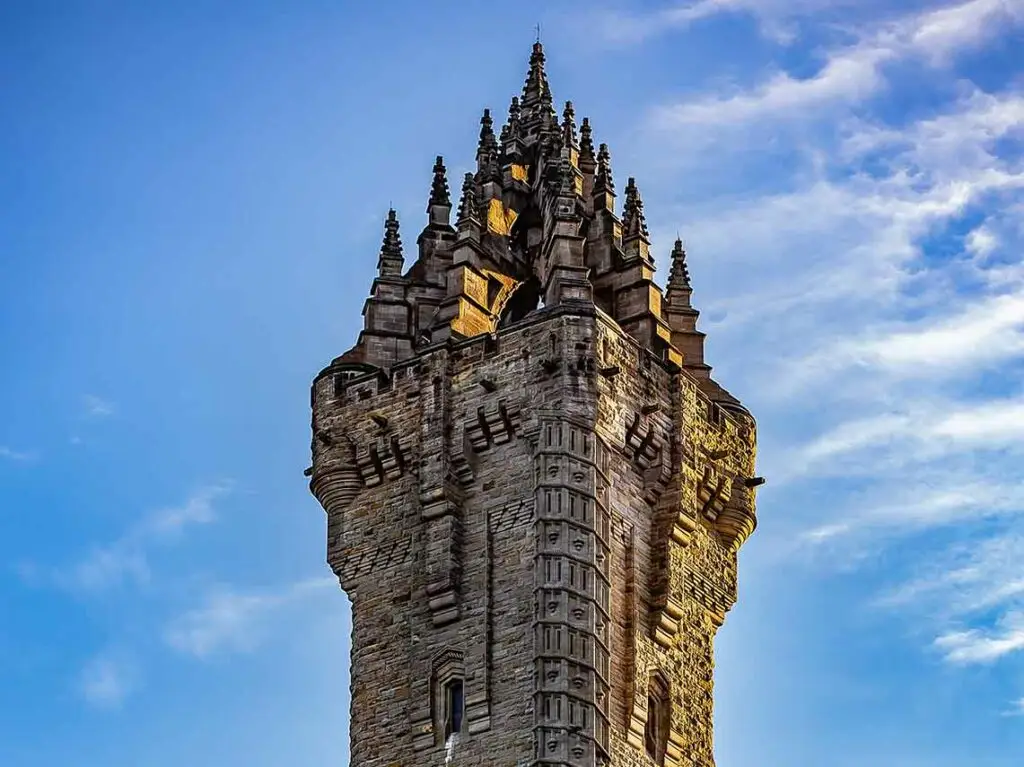 Top of the Wallace Monument in Stirling, Scotland, historic landmark and popular tourist attraction against a blue sky