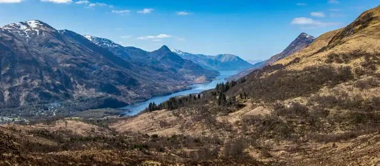 Panoramic view of Loch Leven surrounded by rugged mountains and scenic highland landscape in Argyll, Scotland