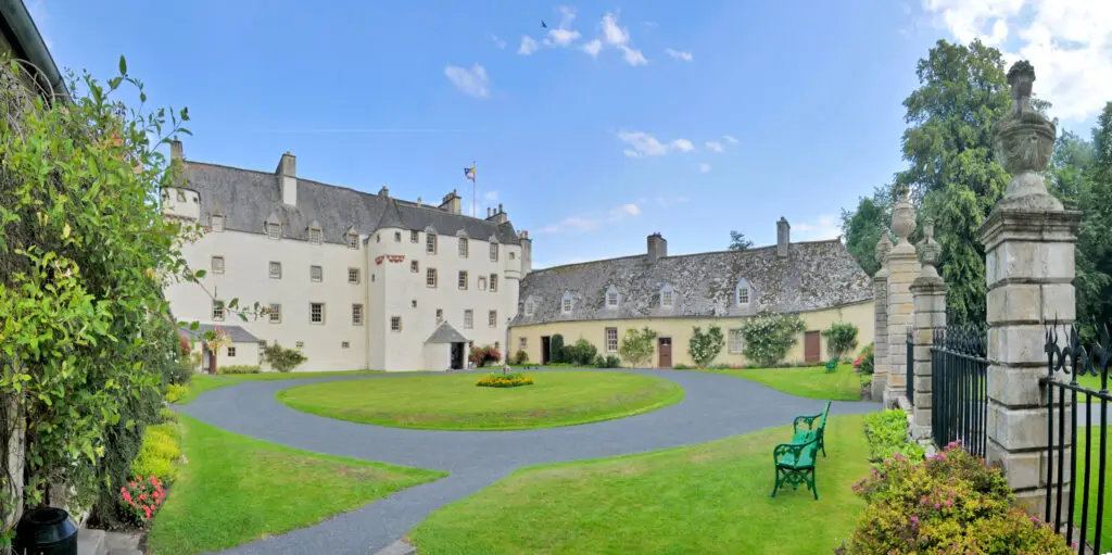 Traquair House in Innerleithen, Scotland, historic Scottish mansion with gardens and courtyard, popular tourist attraction and heritage site