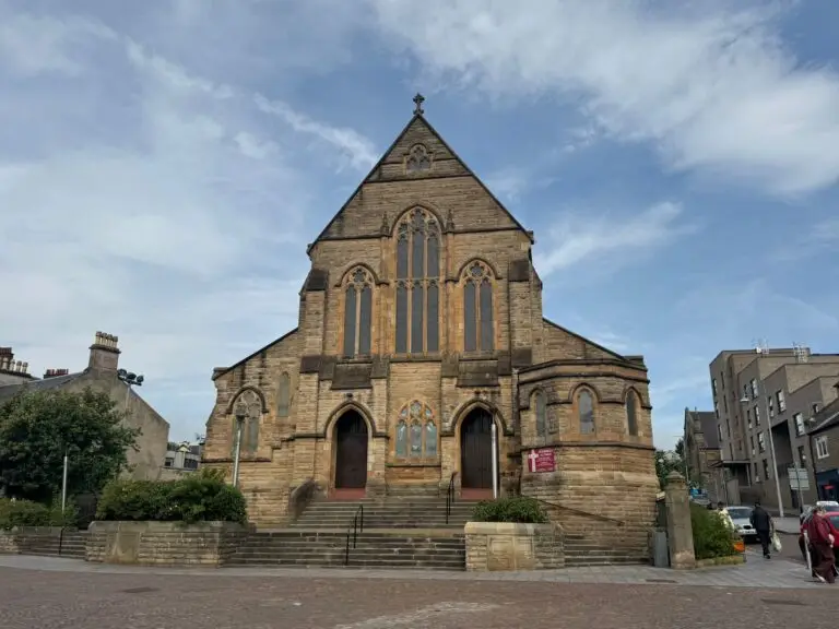 St Patrick’s Church in Coatbridge beneath blue skies and clouds.